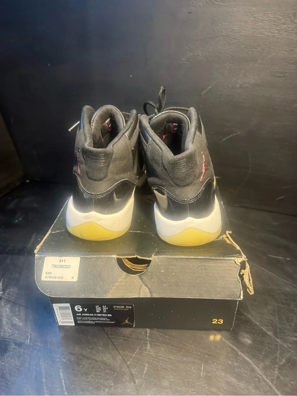 Jordan 11 Retro Mid Black with Gum Sole and Red Jumpman
